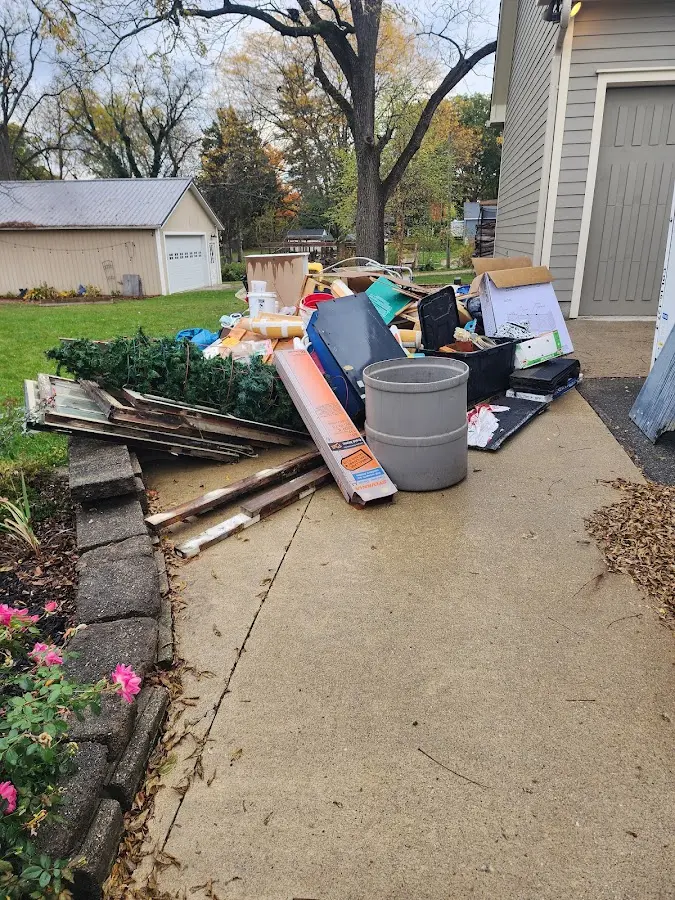 Dumpster being loaded with debris for Commercial Dumpster Rental in Fairview